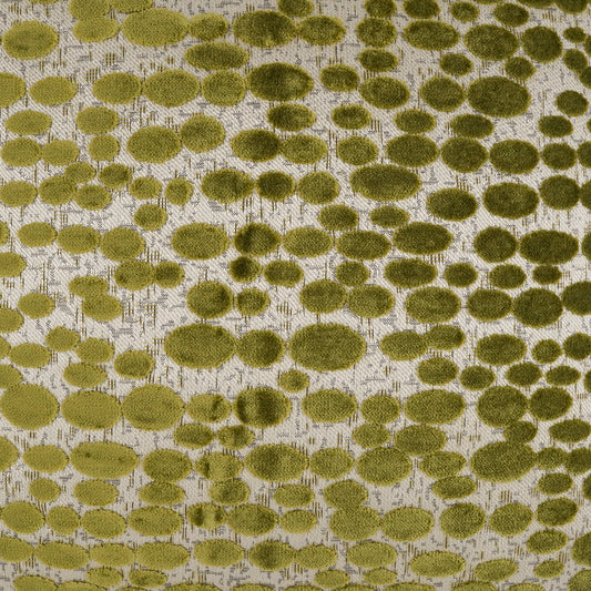 Olive green dotted pattern fabric with fuzzy circular spots on beige background; textured upholstery or décor textile.
