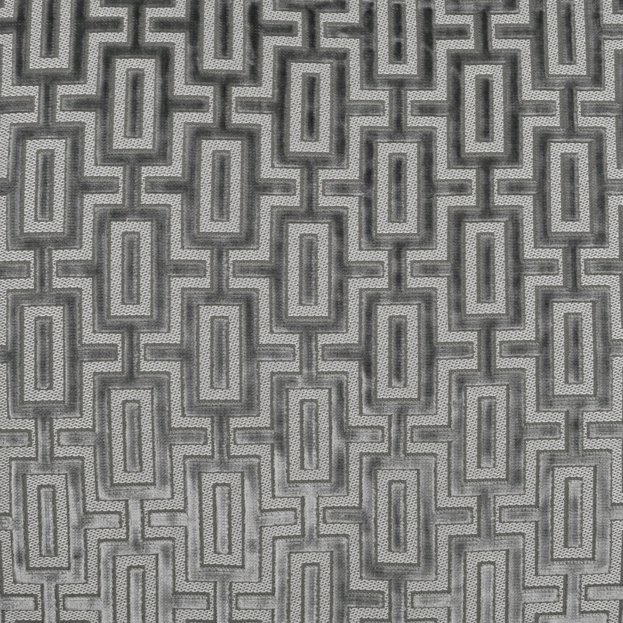 Grey fabric with interlocking rectangular geometric pattern; modern upholstery or home decor material.
