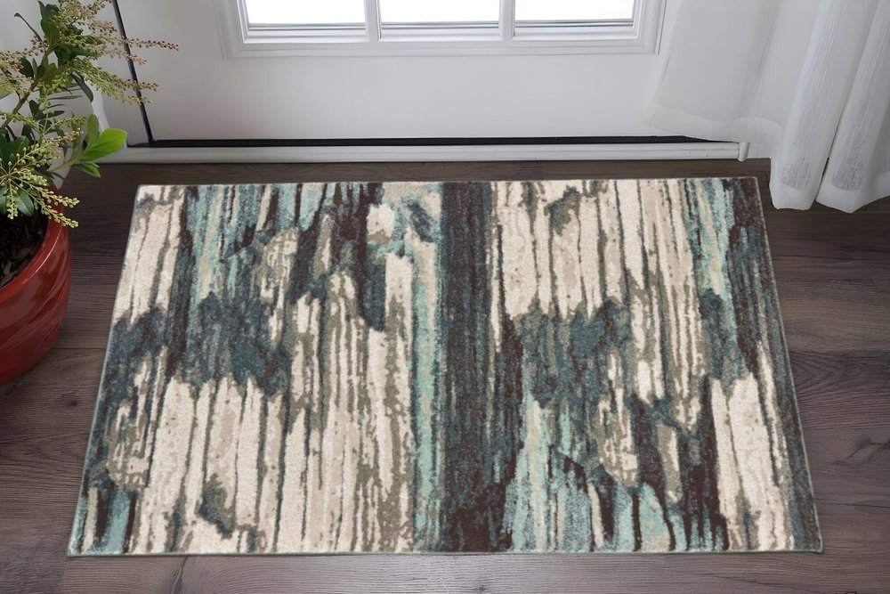 6' X 9' Ivory Blue And Gray Abstract Area Rug