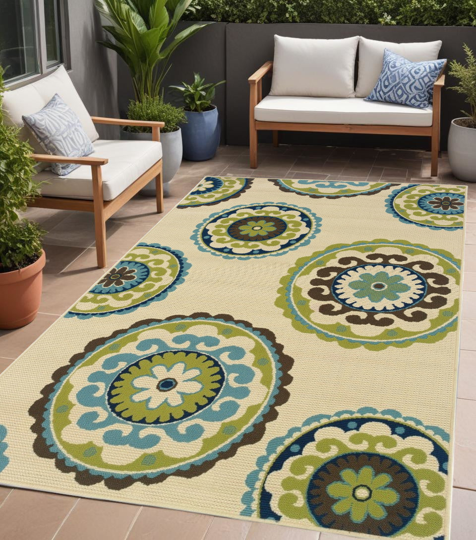 2' X 4' Green and Ivory Floral Indoor Outdoor Area Rug