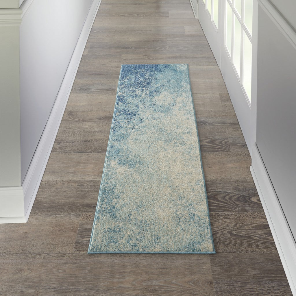 5' X 7' Ivory And Blue Abstract Power Loom Area Rug