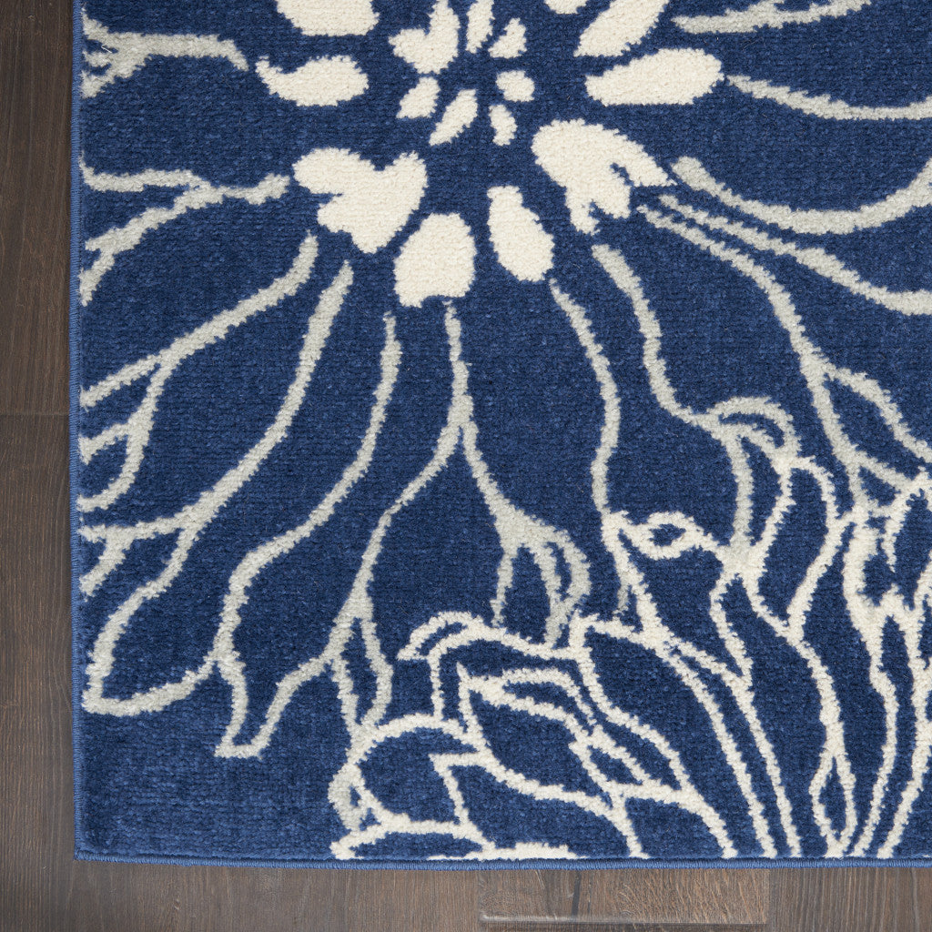 7' X 10' Blue And Ivory Floral Power Loom Area Rug