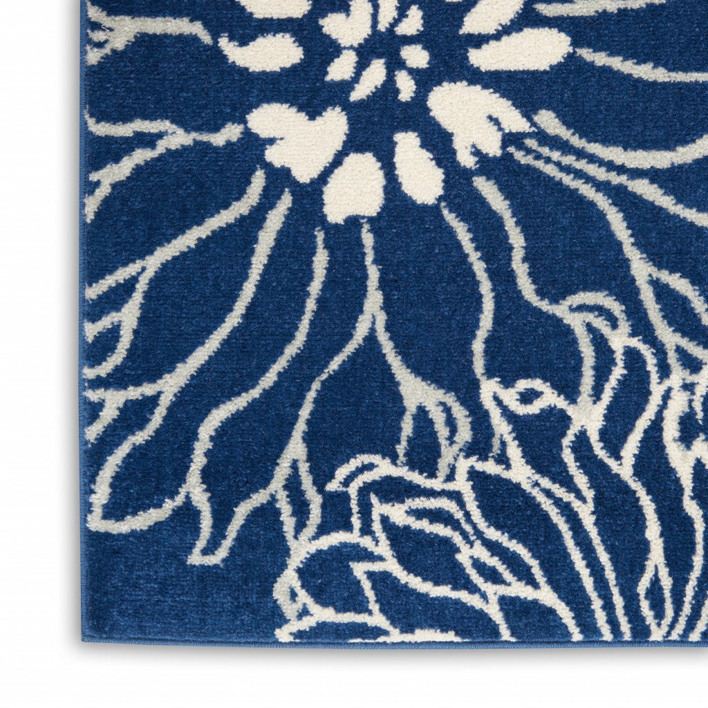 7' X 10' Blue And Ivory Floral Power Loom Area Rug