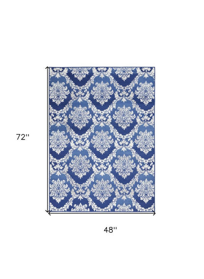 4' X 6' Blue And Ivory Damask Distressed Area Rug
