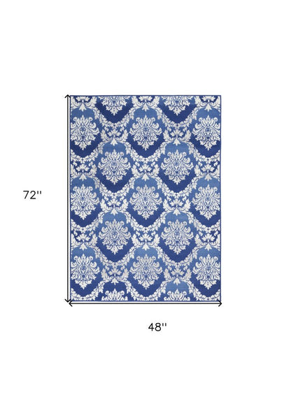 6' X 9' Ivory And Blue Damask Distressed Area Rug