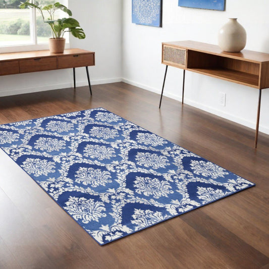 6' X 9' Ivory And Blue Damask Distressed Area Rug
