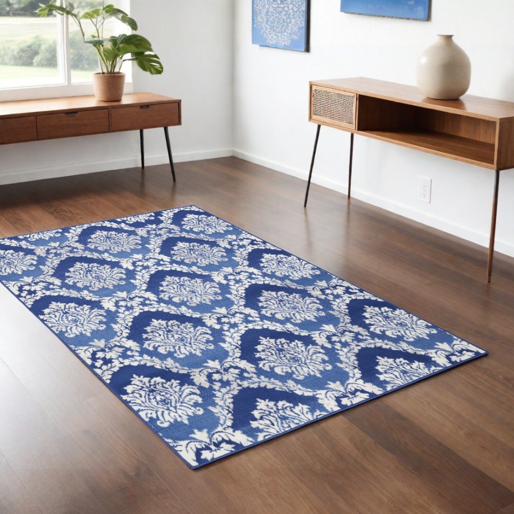 5' X 7' Blue And Ivory Damask Distressed Area Rug