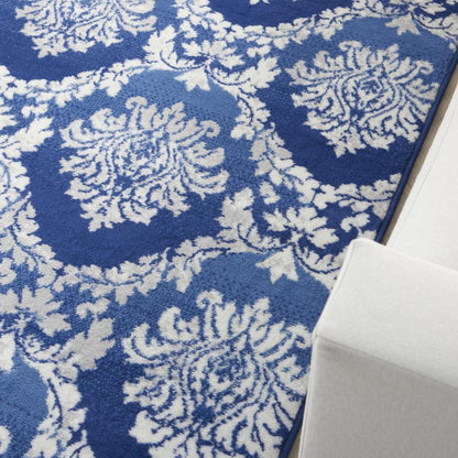 5' X 7' Ivory And Blue Damask Distressed Area Rug