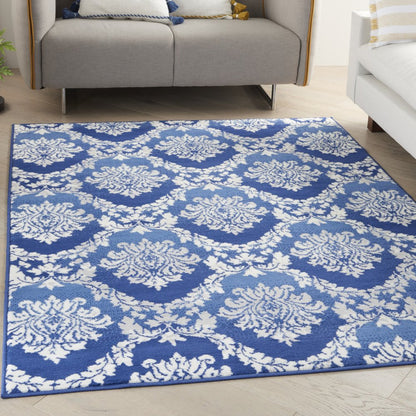 5' X 7' Blue And Ivory Damask Distressed Area Rug