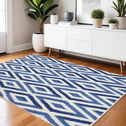 5' X 7' Ivory And Blue Geometric Area Rug