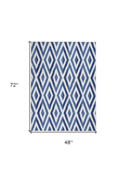 6' X 9' Ivory And Blue Geometric Area Rug