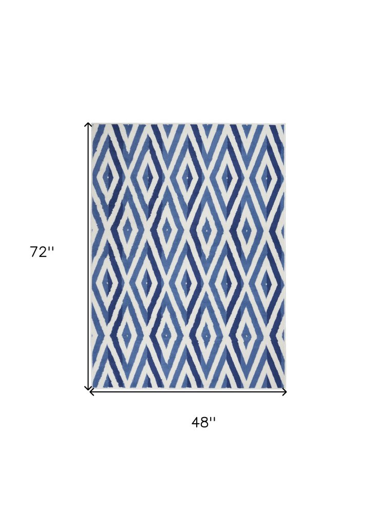 6' X 9' Ivory And Blue Geometric Area Rug