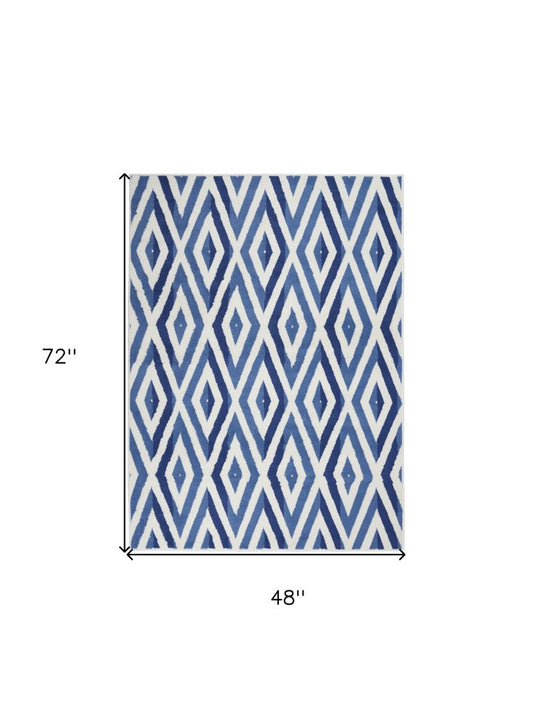 6' X 9' Ivory And Blue Geometric Area Rug
