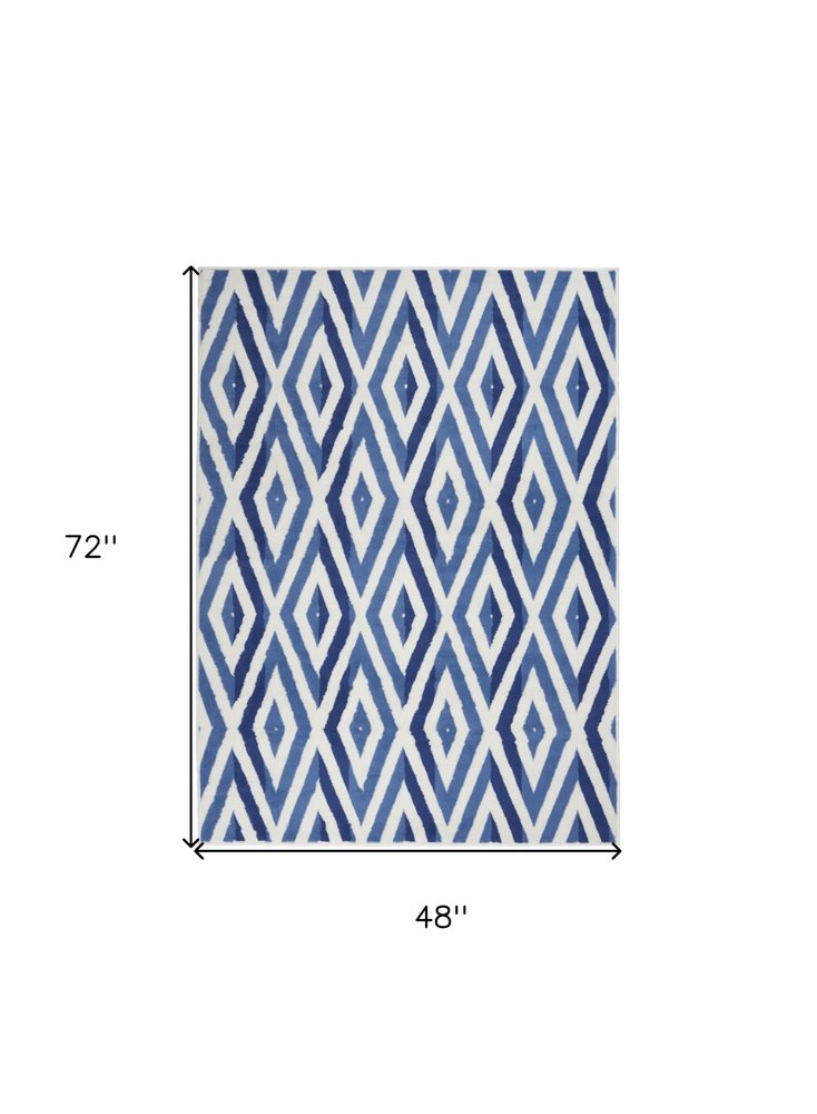 6' X 9' Ivory And Blue Geometric Area Rug