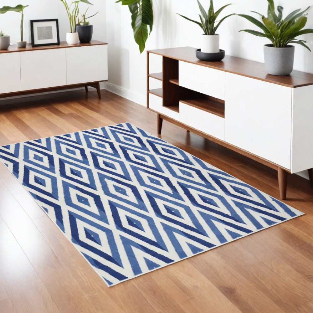 5' X 7' Ivory And Blue Geometric Area Rug