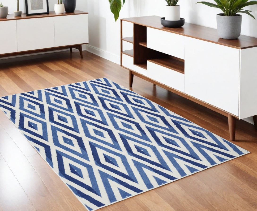 6' X 9' Blue And Ivory Geometric Dhurrie Area Rug