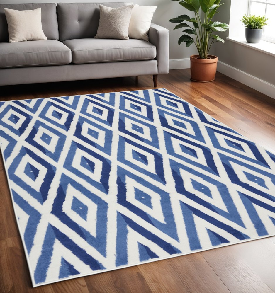 6' X 9' Ivory And Blue Geometric Area Rug
