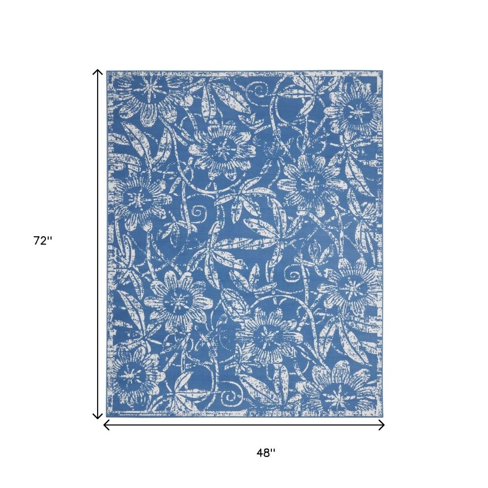 6' X 9' Blue And Ivory Floral Distressed Area Rug