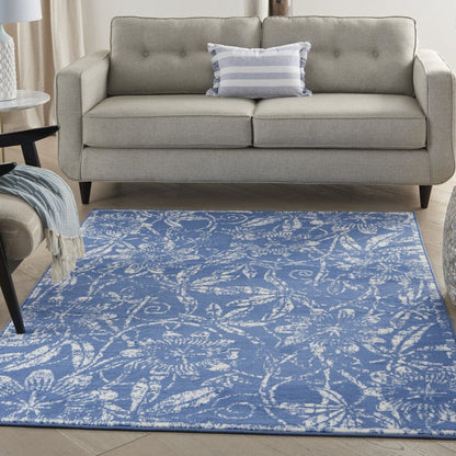 6' X 9' Blue And Ivory Floral Distressed Area Rug