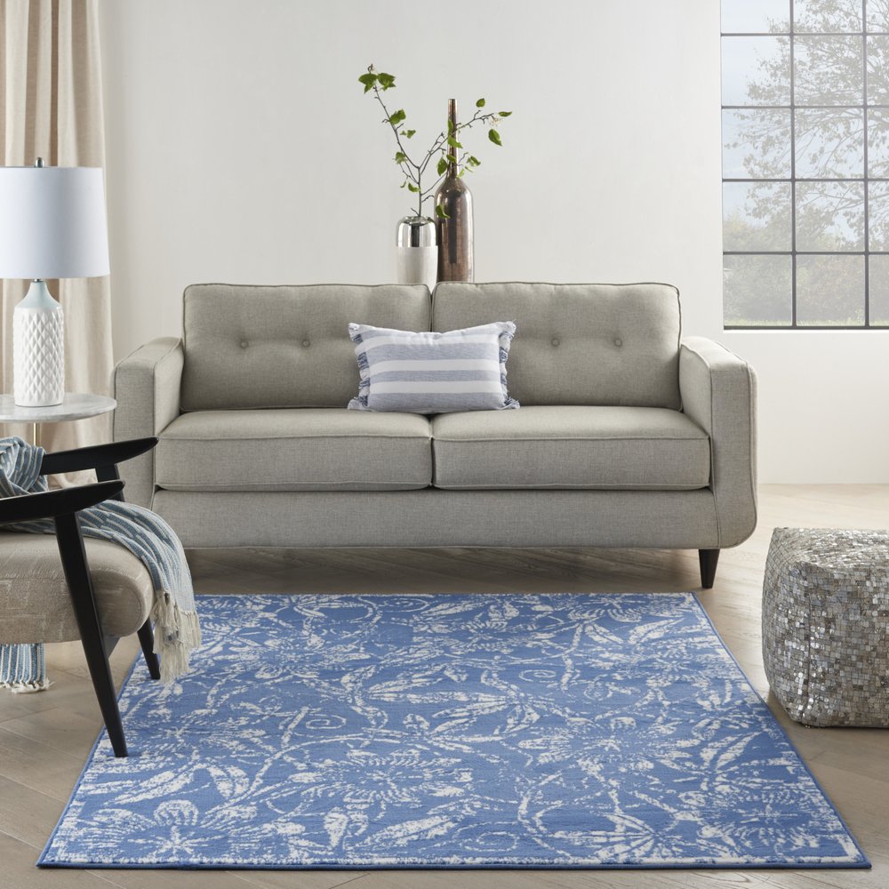 6' X 9' Blue And Ivory Floral Distressed Area Rug
