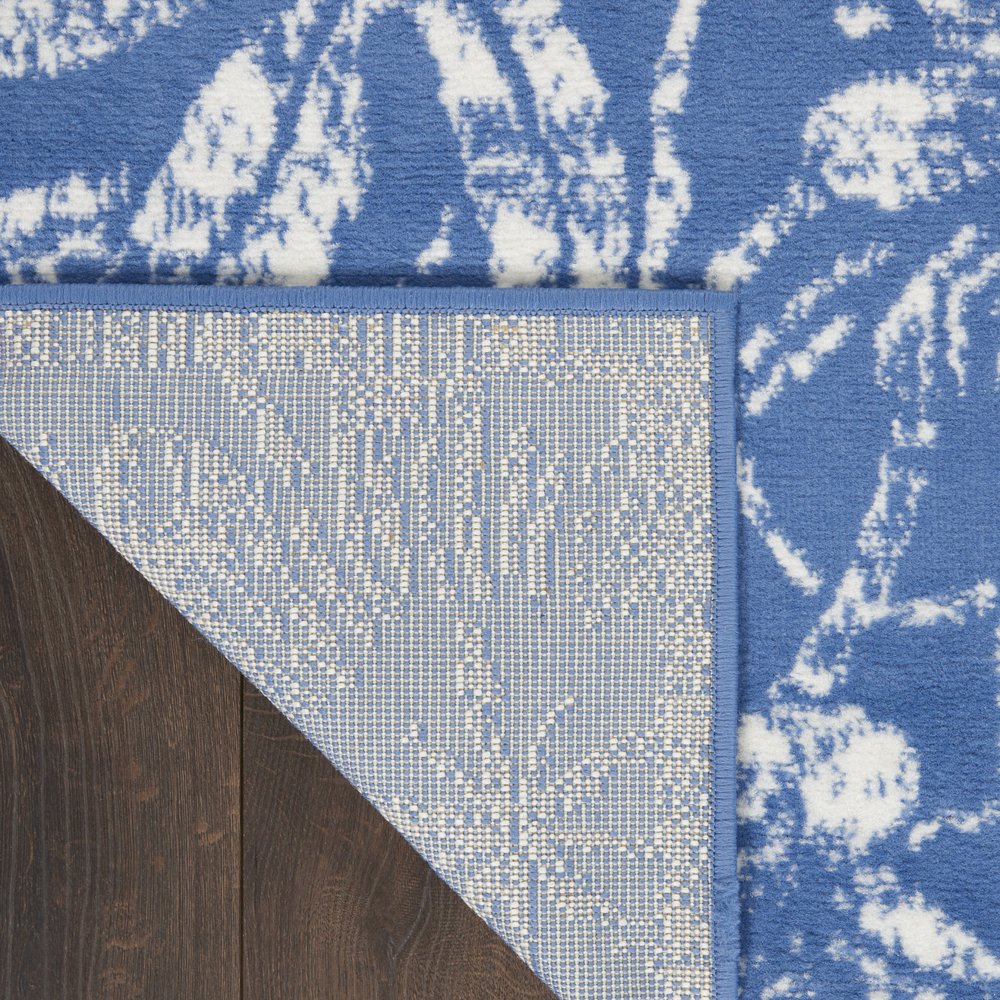 6' X 9' Blue And Ivory Floral Distressed Area Rug