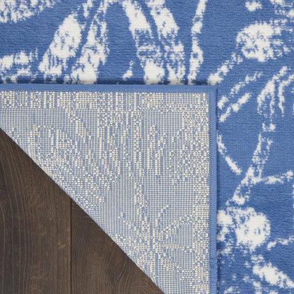 6' X 9' Blue And Ivory Floral Distressed Area Rug