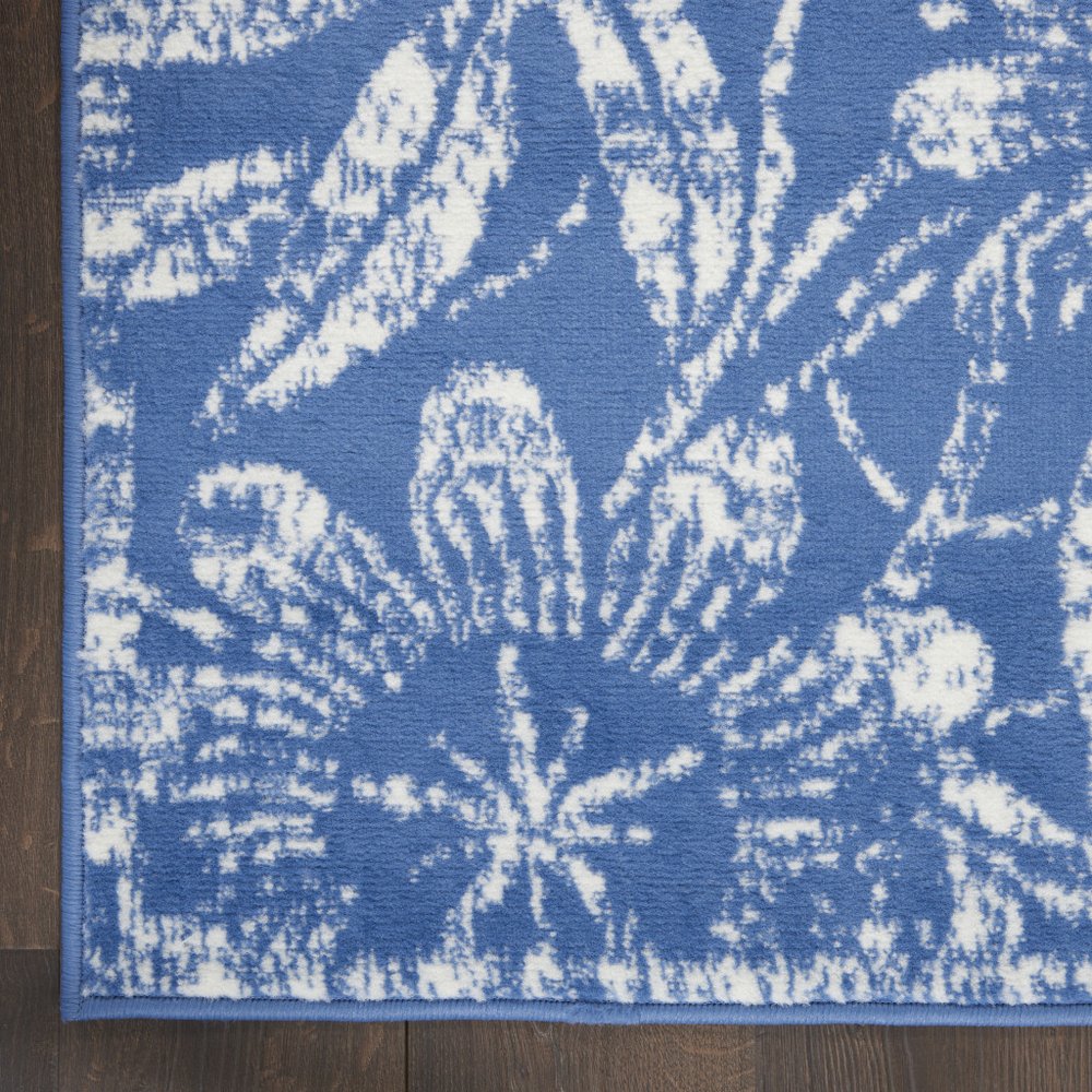 6' X 9' Blue And Ivory Floral Distressed Area Rug