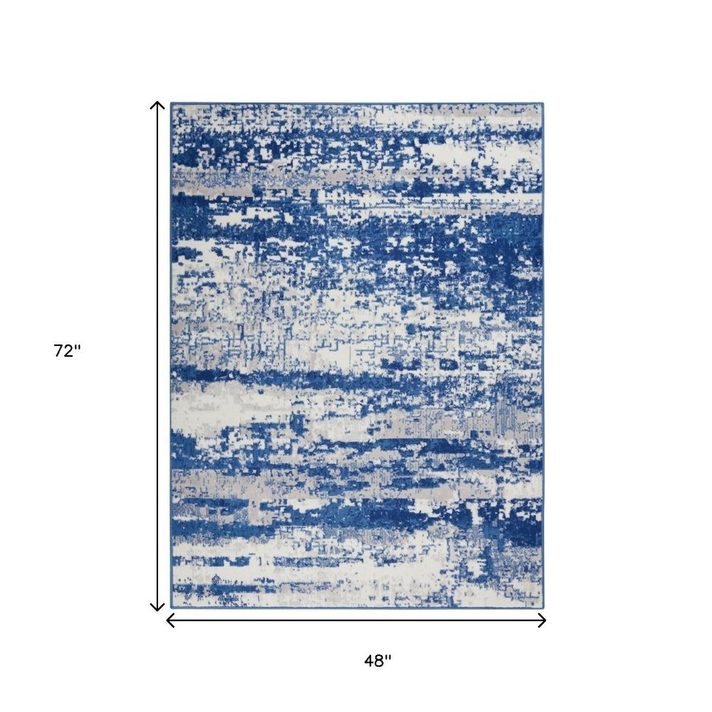 5' X 7' Ivory And Blue Ombre Distressed Area Rug