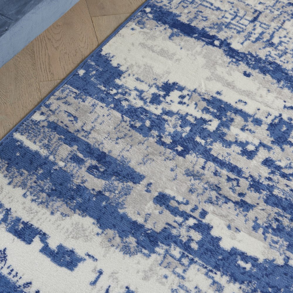 5' X 7' Ivory And Blue Ombre Distressed Area Rug