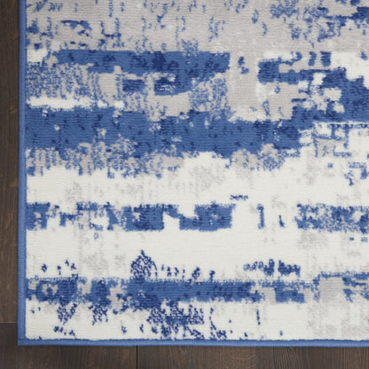 4' X 6' Ivory And Blue Ombre Distressed Area Rug