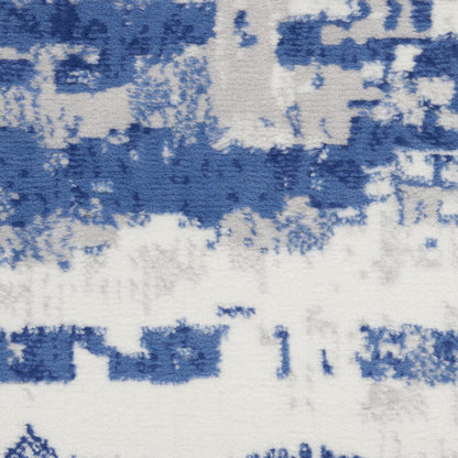 5' X 7' Ivory And Blue Ombre Distressed Area Rug