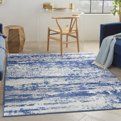 5' X 7' Ivory And Blue Ombre Distressed Area Rug