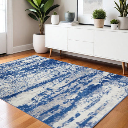 5' X 7' Ivory And Blue Ombre Distressed Area Rug