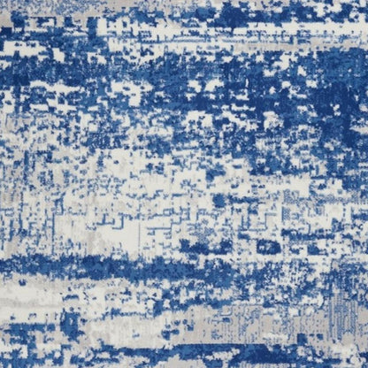 5' X 7' Ivory And Blue Ombre Distressed Area Rug