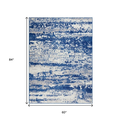 4' X 6' Ivory And Blue Ombre Distressed Area Rug