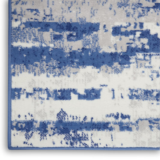 6' X 9' Ivory And Blue Ombre Distressed Area Rug