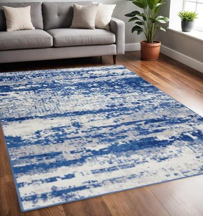 6' X 9' Ivory And Blue Ombre Distressed Area Rug