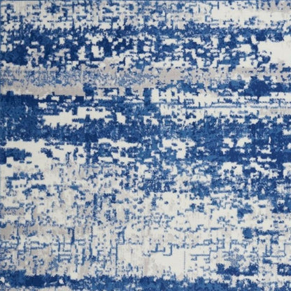 5' X 7' Ivory And Blue Ombre Distressed Area Rug