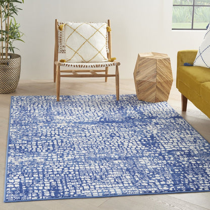 5' X 7' Ivory And Blue Geometric Area Rug