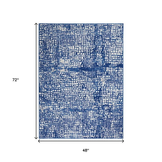 4' X 6' Ivory And Blue Geometric Area Rug