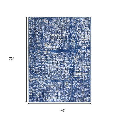 4' X 6' Ivory And Blue Geometric Area Rug