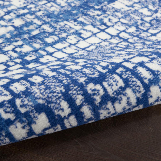 6' X 9' Blue And Ivory Abstract Dhurrie Area Rug