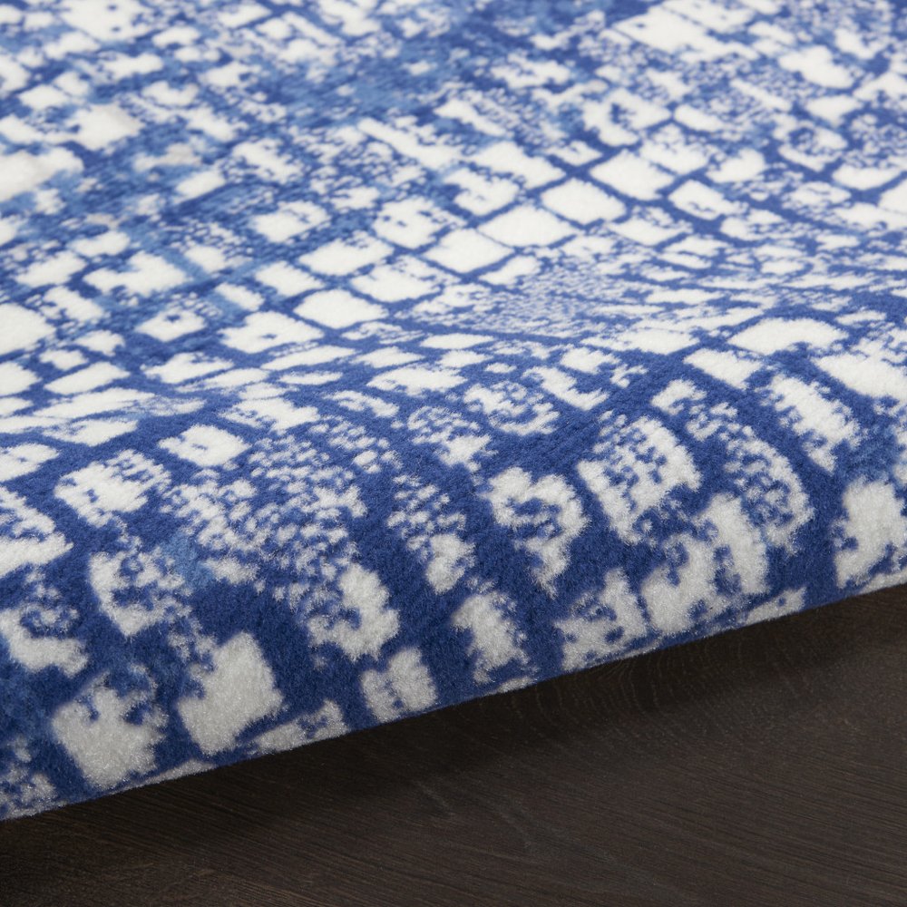 6' X 9' Ivory And Blue Geometric Area Rug