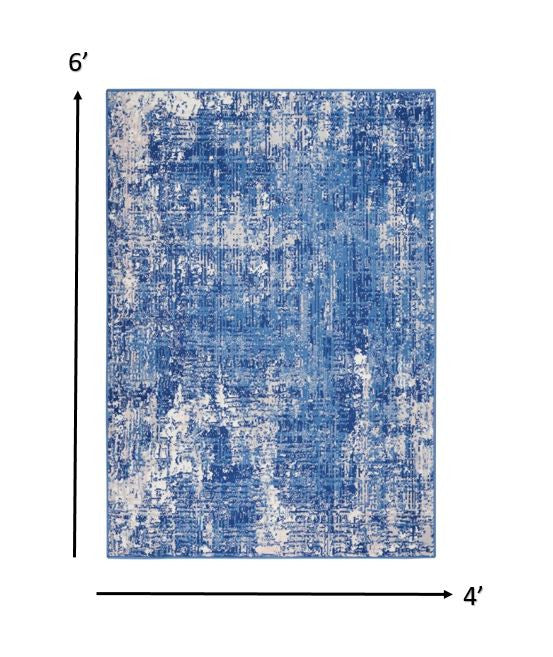 4' X 6' Blue And Ivory Abstract Dhurrie Area Rug