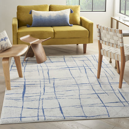 6' X 9' Ivory And Blue Geometric Distressed Area Rug