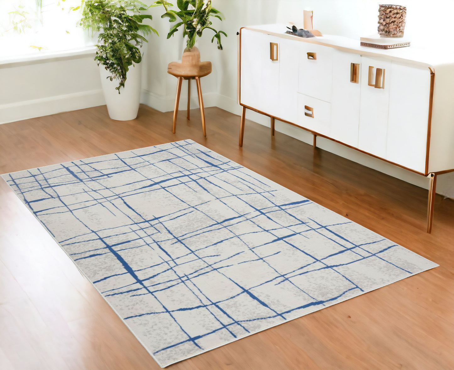 6' X 9' Blue And Ivory Abstract Dhurrie Area Rug