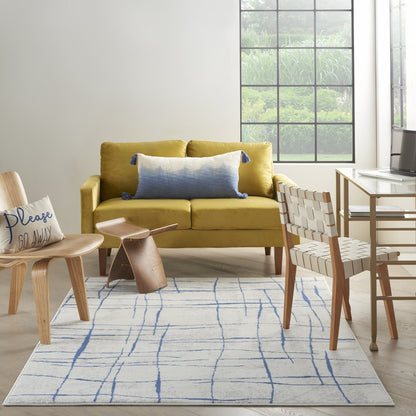 6' X 9' Ivory And Blue Geometric Distressed Area Rug