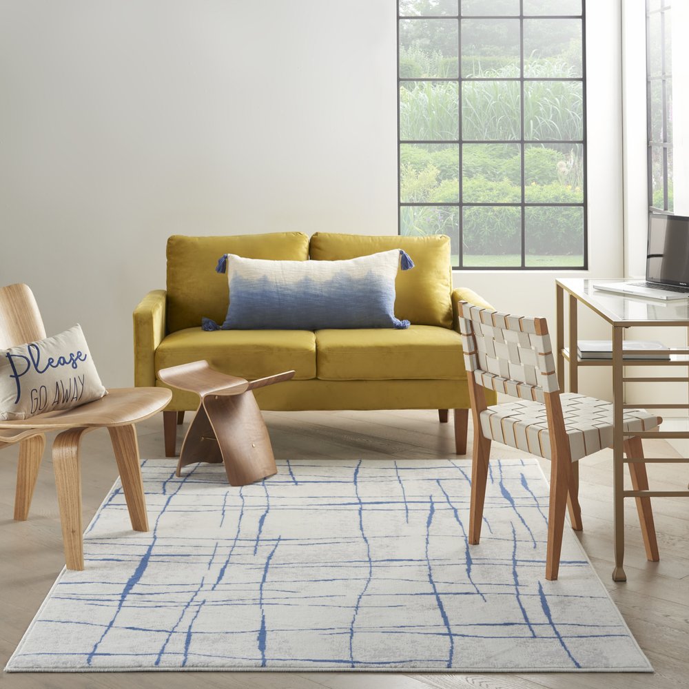 6' X 9' Ivory And Blue Geometric Distressed Area Rug