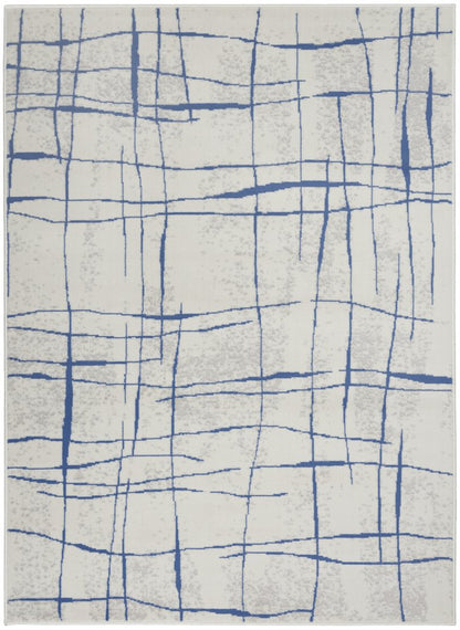 6' X 9' Ivory And Blue Geometric Distressed Area Rug