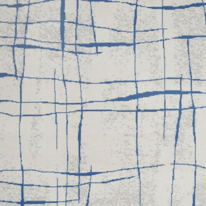 6' X 9' Ivory And Blue Geometric Distressed Area Rug